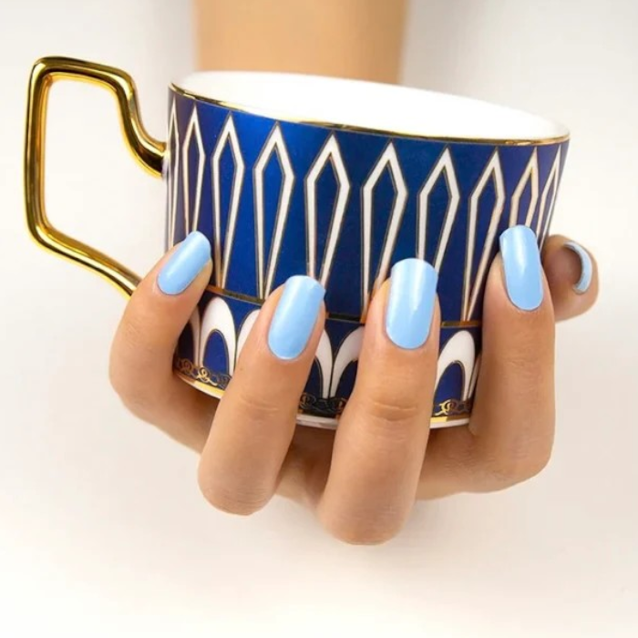 Applied pastel blue gel wraps with a glossy finish, adding a touch of tranquility and elegance to any look.