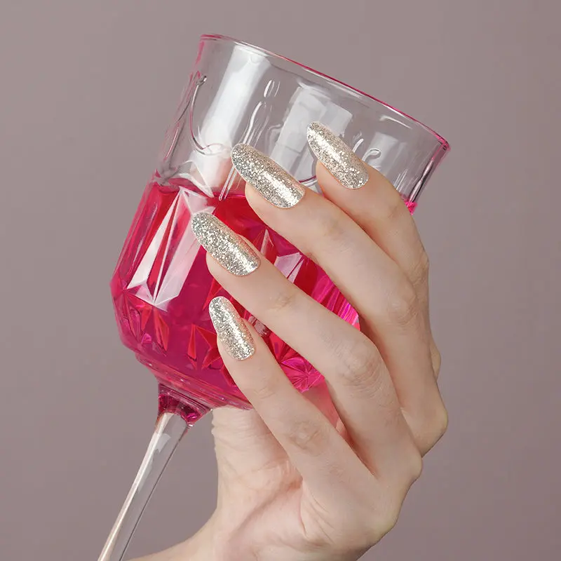 Nails embellished with Stardust gel wraps, showcasing a twinkling effect that elevates any look with a touch of elegance.