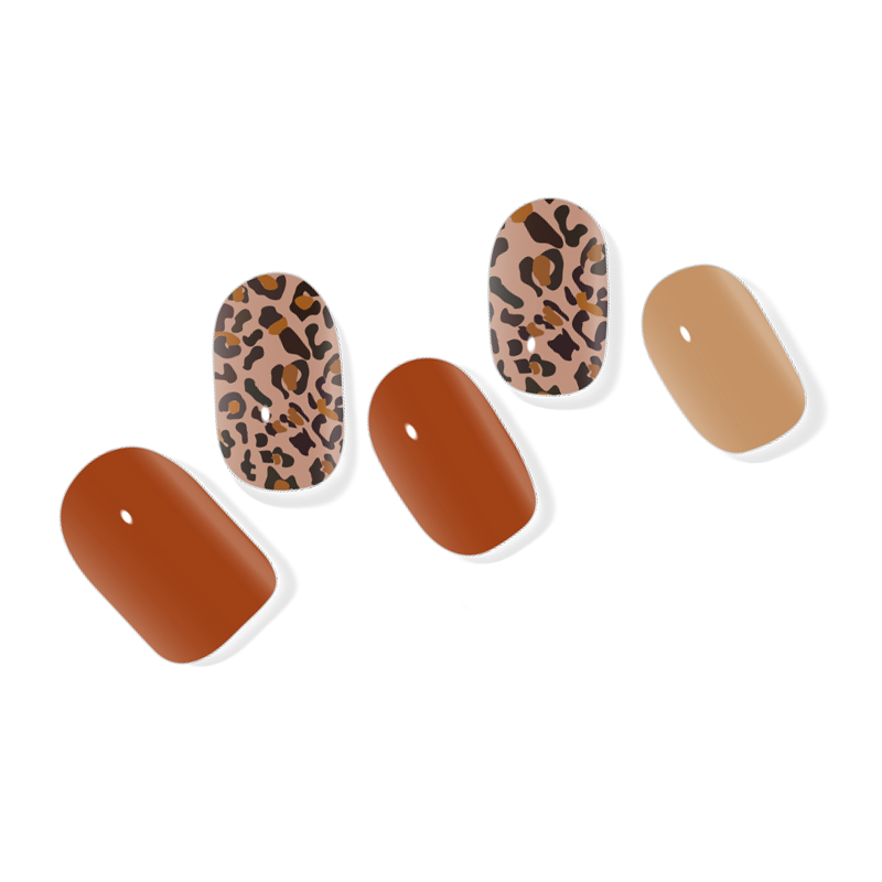 Leopard print semi-cured gel nail wraps with a glossy finish, perfect for an adventurous and fierce manicure.