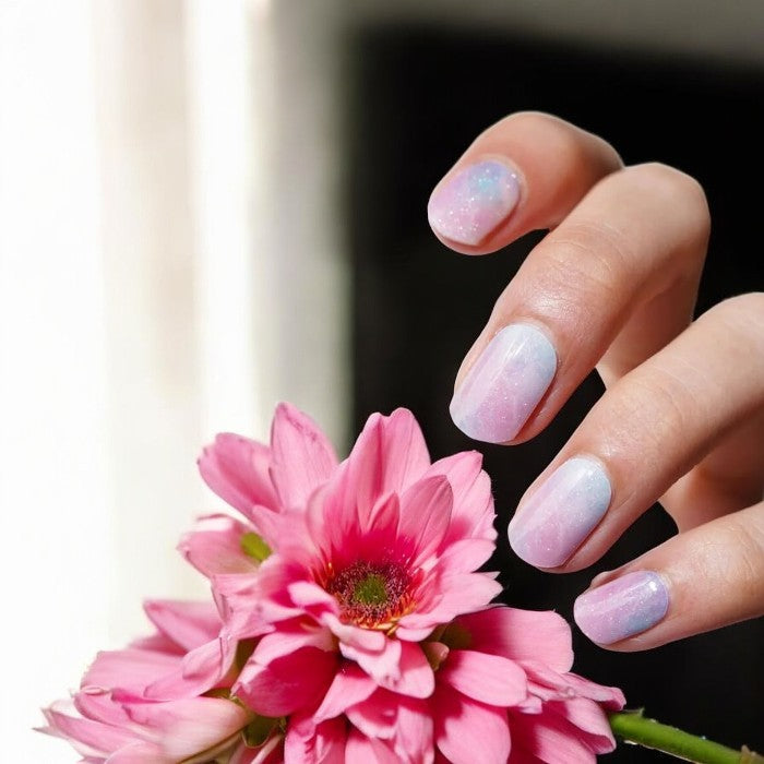 Nails featuring Cotton Candy gel nail wraps, showcasing a delightful blend of pink and blue hues for a playful manicure.