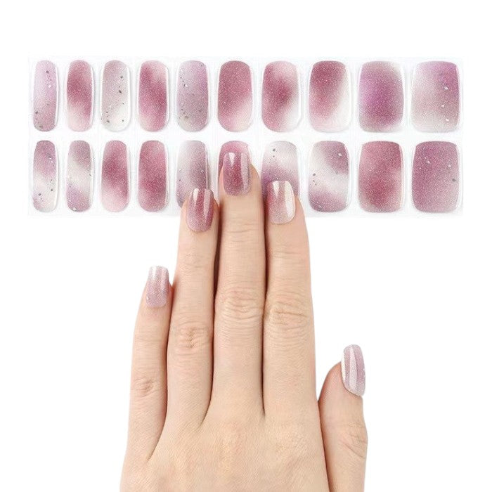 Sticker sheet presenting lavender gel nail wraps with silver glitter in various sizes.