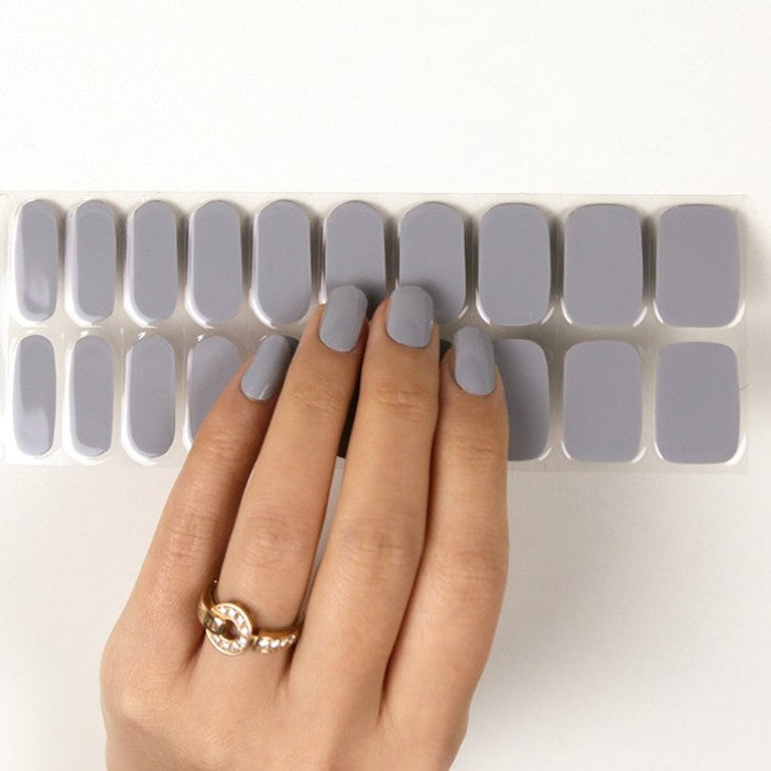 Sticker sheet of soft gray Fluffy Bunny semi-cured gel wraps, featuring various sizes for a seamless and damage-free application.