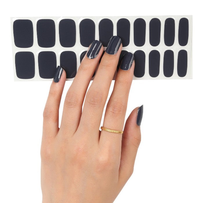 Sticker sheet of deep charcoal gray semi-cured gel wraps, offering multiple sizes for a precise and easy application.