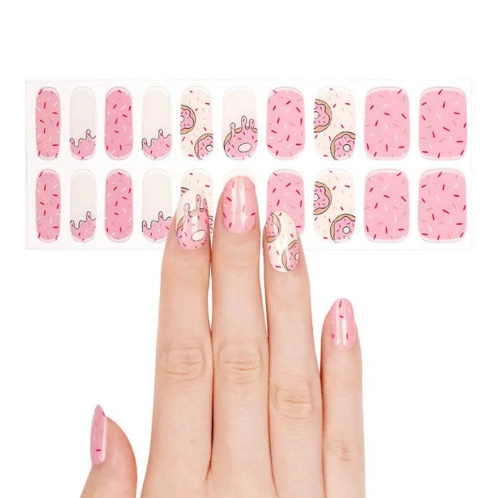 Sticker sheet of Strawberry Sprinkles gel nail wraps in various sizes for easy application.