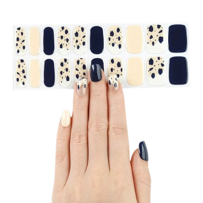 Sticker sheet of Speckles semi-cured gel nail wraps in multiple sizes for versatile styling.