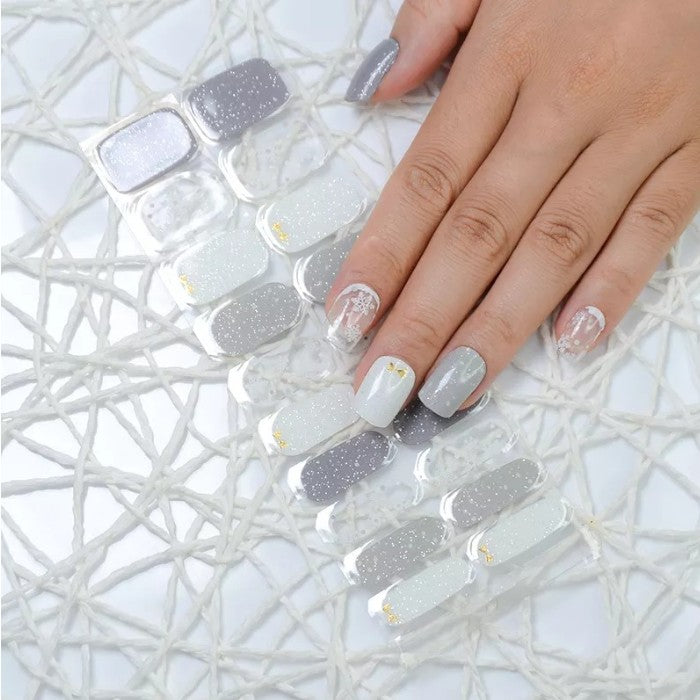 Sticker sheet displaying Clarity semi-cured gel nail wraps in various sizes for a customizable fit.