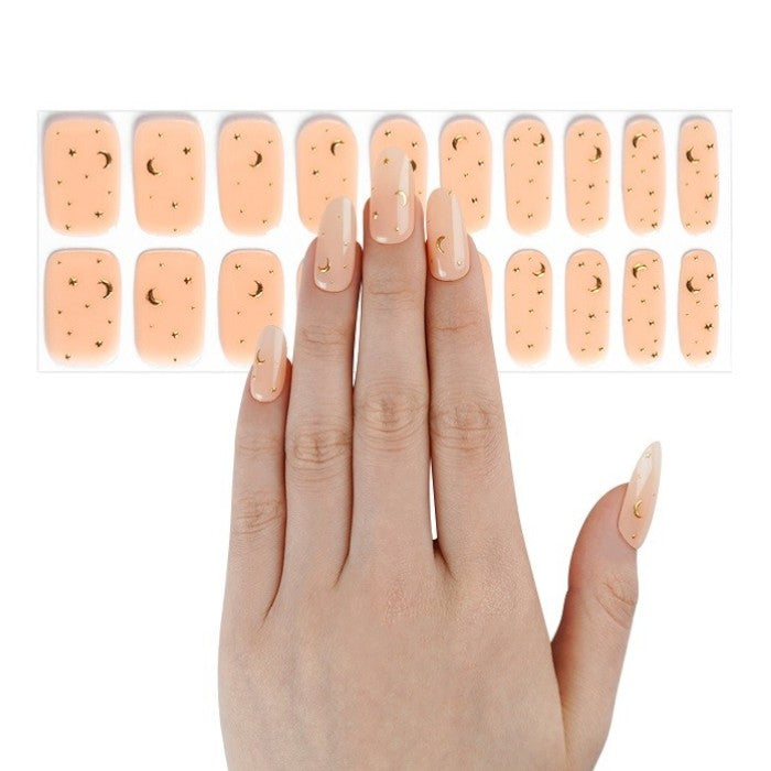 Sticker sheet displaying warm apricot gel nail wraps in assorted sizes.