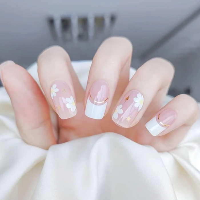 Fingers adorned with Lilac Dreams gel nail wraps, presenting a soothing and elegant pastel purple manicure.