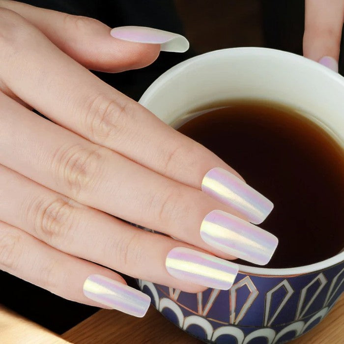iridescent yellow gel wraps with a delicate blue shimmer, creating a refined and graceful manicure that exudes sophistication.