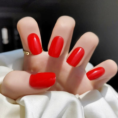Applied classic red gel wraps with a high-shine finish, creating the perfect bold and elegant manicure for any occasion.