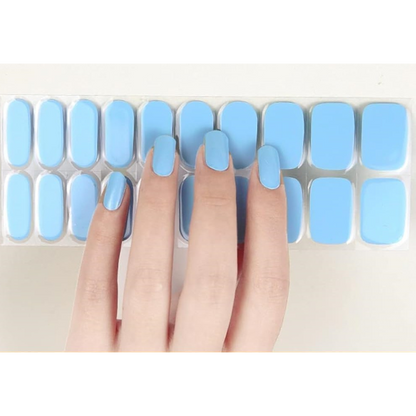Sticker sheet of pastel blue Daydream semi-cured gel wraps, featuring various sizes for a perfect and damage-free application.