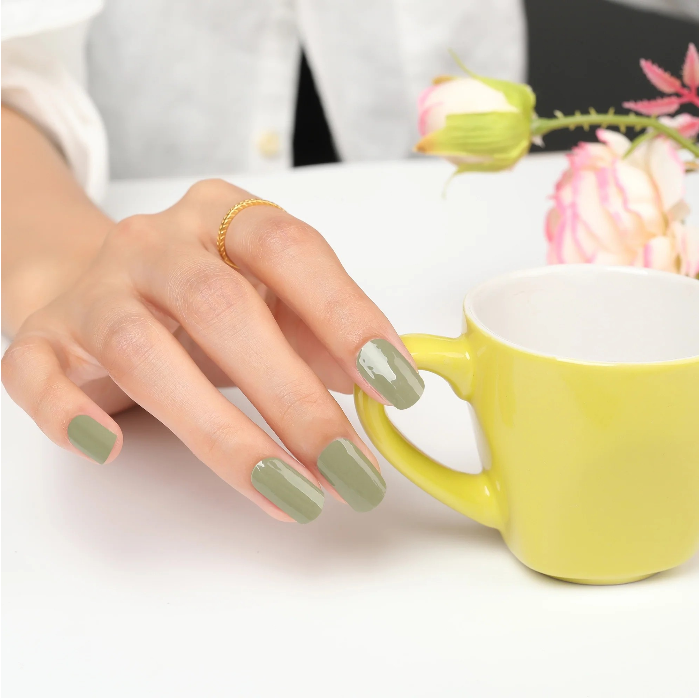 Applied muted olive green gel wraps with a glossy finish, showcasing a chic and understated manicure.
