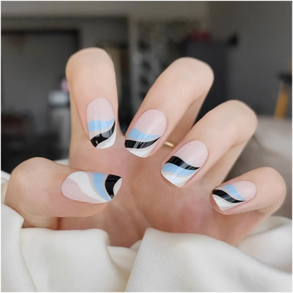 Nails adorned with Ocean Swirl wraps, showcasing a dynamic teal marble design.