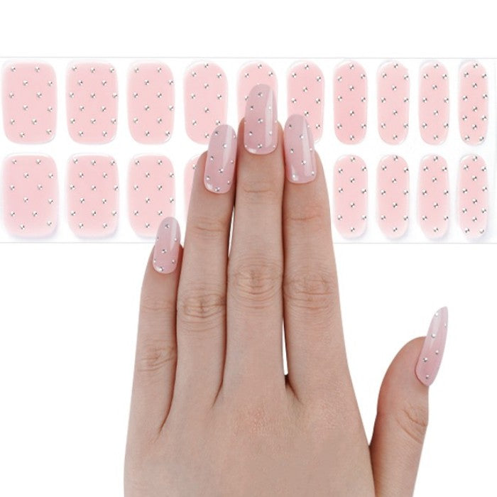 Sticker sheet displaying soft pastel pink gel nail wraps with iridescent shimmer in various sizes.