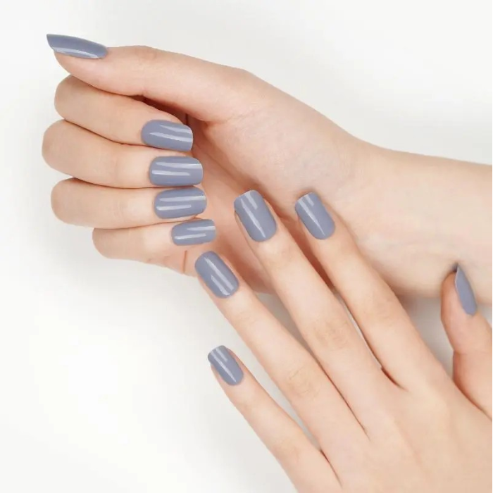 Applied taupe gel wraps with a delicate shimmer, offering a refined and polished look that complements any outfit.